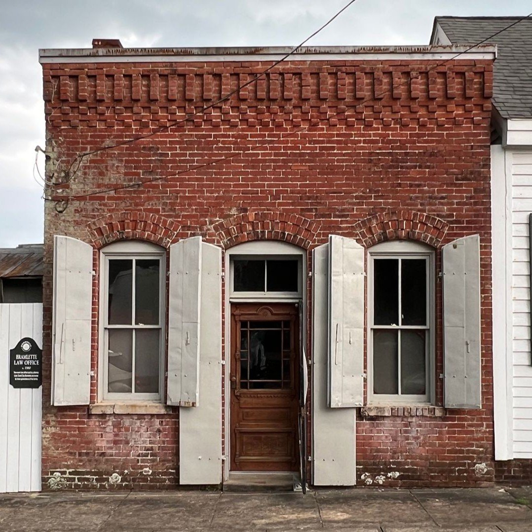 Parish & County Properties Woodville office — red brick building
